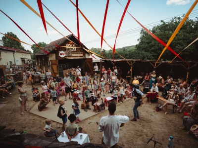 Performers and audience at a rural festival
