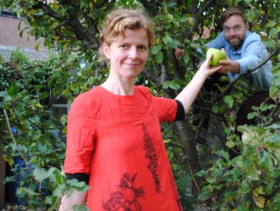 A woman and man next to trees