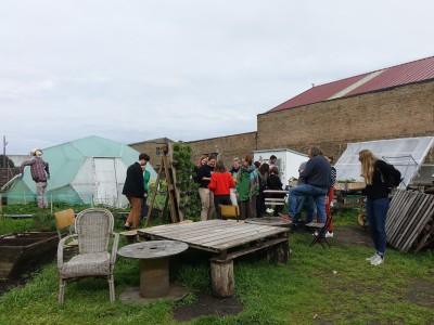 A group of people visiting a garden