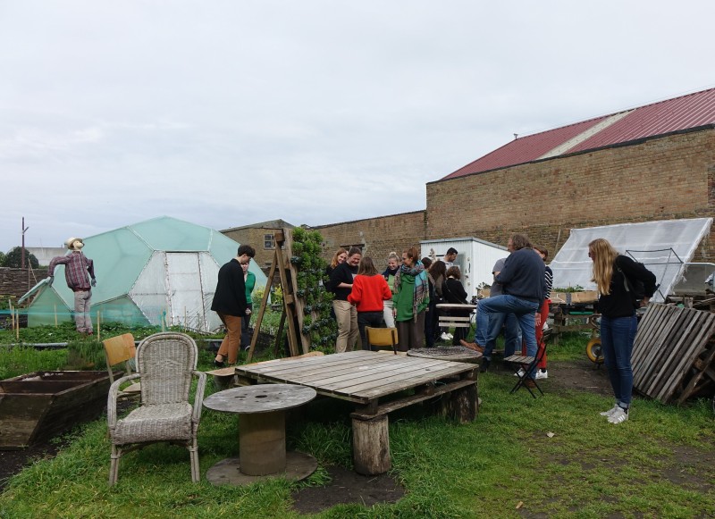 A group of people visting a garden