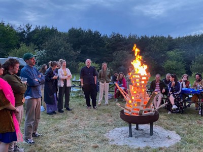 People standing around a fire