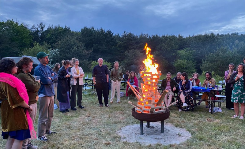 People standing around a fire